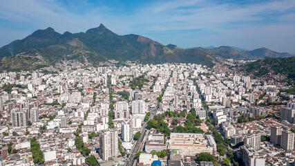 Aerial view of the urban area of the North Zone of Rio de Janeiro and in the background the mountain range that makes up the Tijuca massif and the Tijuca National Park.