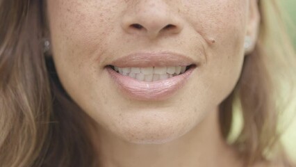 Close up of female mouth talking to camera in a Vox pop style