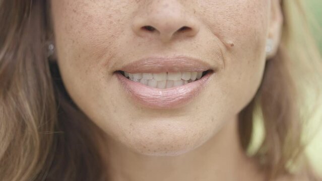 Close up of female mouth talking to camera in a Vox pop style