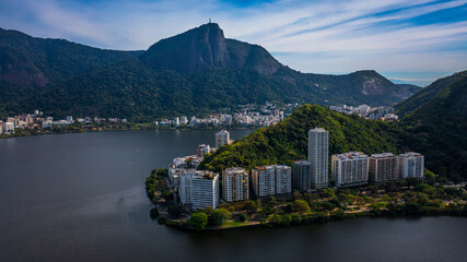 Aerial drone view of Rodrigo de Freitas Lagoon, Ipanema and Leblon neighborhoods and beaches. In the background is Corcovado mountain, Christ the Redeemer and part of the Tijuca National Park.