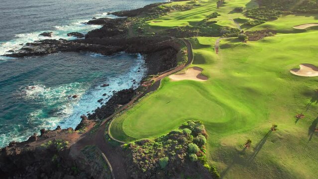 Aerial view of a golf club field at sunset on Tenerife Island, Spain.