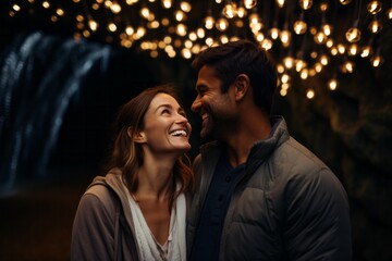 Fototapeta premium Couple in their 30s smiling at the Waitomo Glowworm Caves in Waikato New Zealand