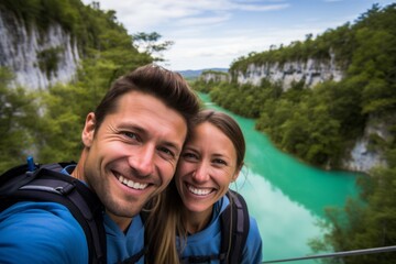Couple in their 30s smiling at the Plitvice Lakes National Park in Croatia