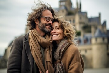 Couple in their 40s at the Mont Saint-Michel in Normandy France