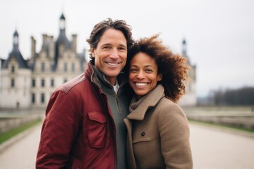 Couple in their 40s smiling at the Château de Chambord in Chambord France
