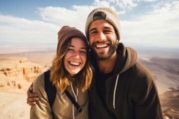 Couple in their 30s smiling at the Masada in Southern District Israel