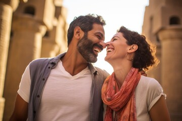 Fototapeta premium A couple in their 40s smiling at the Luxor Temple in Luxor Egypt