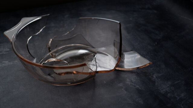 Broken pyrex dish on a table.