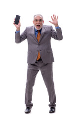 Old businessman talking by phone isolated on white