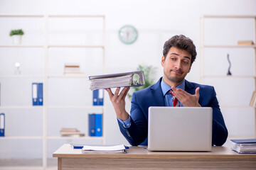 Young male employee working in the office