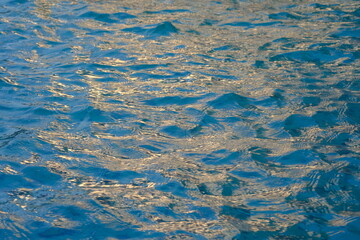 The surface of water is blue with ripples. water.