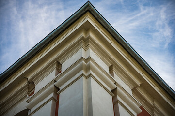 Old church corner on the blue sky background