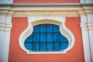 Old church window on a colorful wall