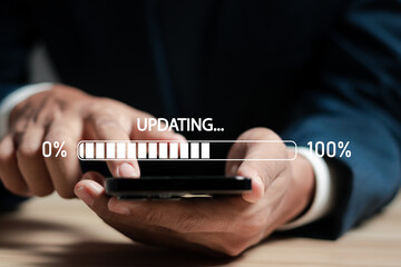 Businessman working and installing update process. Software updates or operating system upgrades to...