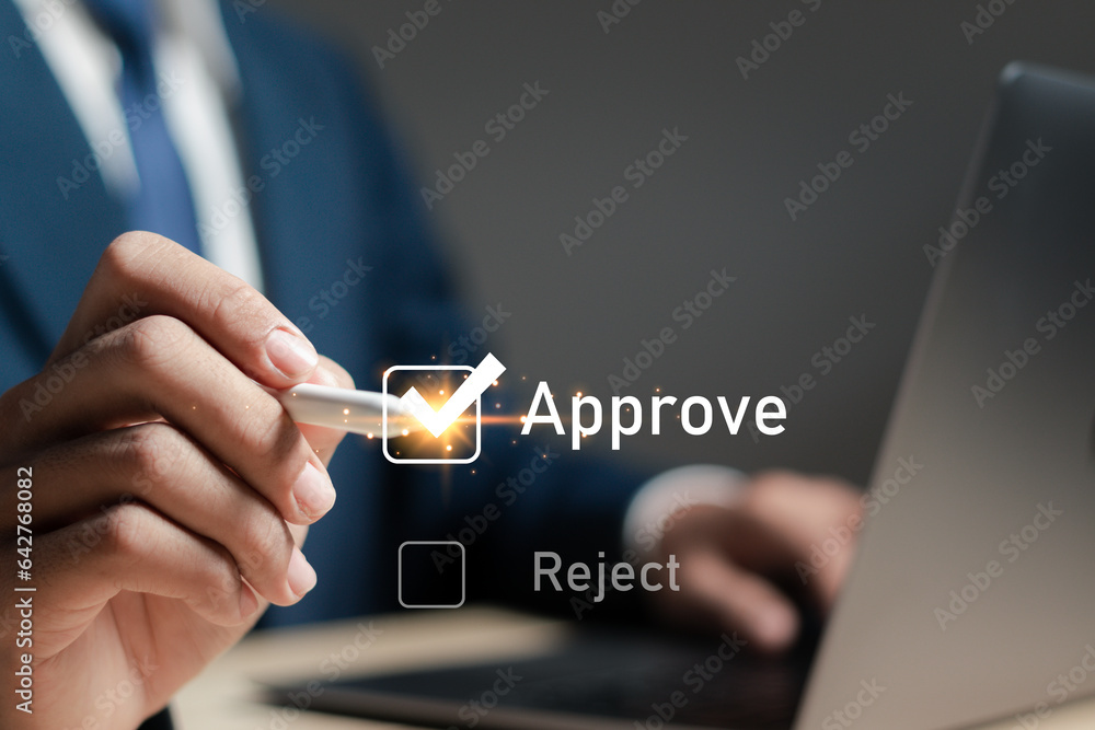 Aufkleber businessman putting a valid check mark in the check box to approve documents and project ideas
