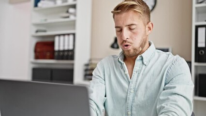 Young caucasian man business worker using laptop working stressed at office - Powered by Adobe