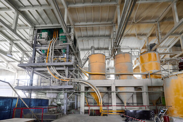 Bunkers with bulk components at silica production factory