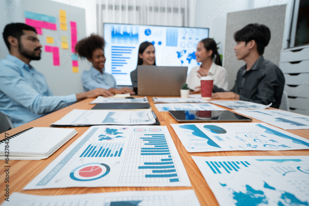 Aufkleber focus financial dashboard paper showing graphs and chart with blurred background of diverse business