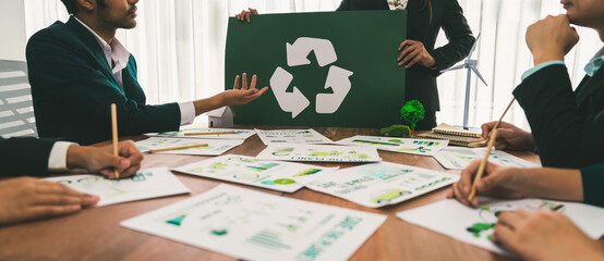 Group of business people planning and discussing on recycle reduce reuse policy symbol in office meeting room. Green business company with eco-friendly waste management regulation concept.Trailblazing