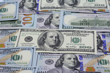 Background of 100 dollar bills. Texture old and new US dollar bills.