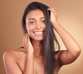 Hair, beauty and portrait of happy Indian woman in studio for cosmetic, wellness or texture and...