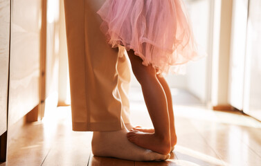 Dance, learning and feet of father and daughter for ballet, support and love. Music, help and youth...