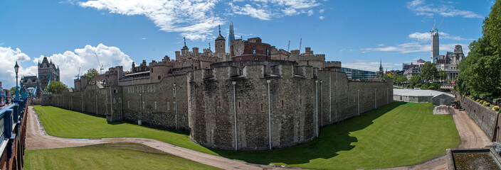 Panorama of the Tower of London in central London. Park and old stone castle in the city.