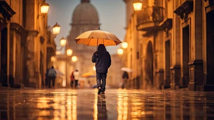 Fotobehang a man walking in the rain holding an umbrella and looking at the dome of st pauls cathedral, paris © Golib Tolibov