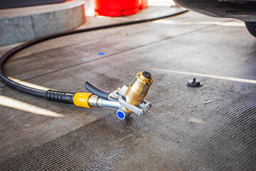 gas gun at a gas station for refueling a car with gas. World economic crisis