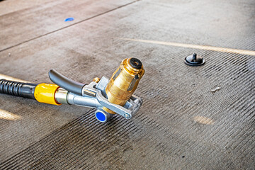 special gas gun at a gas station for refueling a car with gas with a valve. World economic crisis