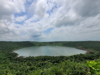 Lonar Lake, also known as Lonar crater, is a notified National Geo-heritage Monument,[2][3][4] saline, soda lake, located at Lonar in Buldhana district, Maharashtra, India. Lonar Lake is an astrobleme © Purva
