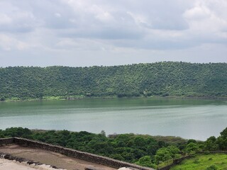 Lonar Lake, also known as Lonar crater, is a notified National Geo-heritage Monument,[2][3][4] saline, soda lake, located at Lonar in Buldhana district, Maharashtra, India. Lonar Lake is an astrobleme
