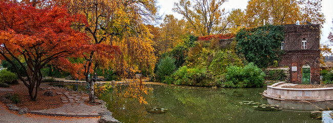 Budapest, Hungary - Pakr in Margaret Island in autumn with colorful leaves with a pond.