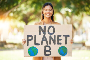 Woman, poster and climate change sign at park for earth, environment and green or eco friendly...