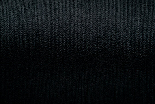 Abstract fabric texture background, close up picture of black color thread, macro image of textile surface, wallpaper template for banner, website, poster, backdrop.