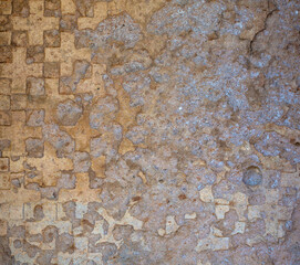 Old grungy wall texture with cracks with vintage ornament