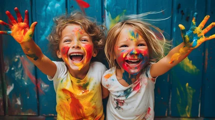 Fotobehang Kids laughing and having fun shows dirty hands with colorful paint © Trendy Graphics