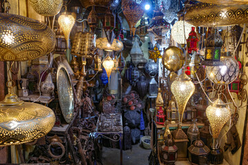 Fototapeta na wymiar Marrakech, Morocco - Feb 10, 2023: Traditional Arabic lamps on sale in the souks of Marrakech