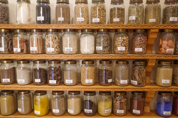 Marrakech, Morocco - Feb 8, 2023: Jars of dried seeds and spices at the Moroccan Museum of Culinary Arts