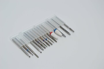 A set of cutters of different sizes in a stand container for hardware manicure. Manicure and pedicure tools
