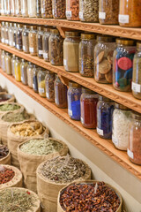 Marrakech, Morocco - Feb 8, 2023: Jars of dried seeds and spices at the Moroccan Museum of Culinary Arts