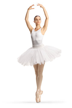 Full length profile shot of a ballerina in a white tutu dress dancing with arms up