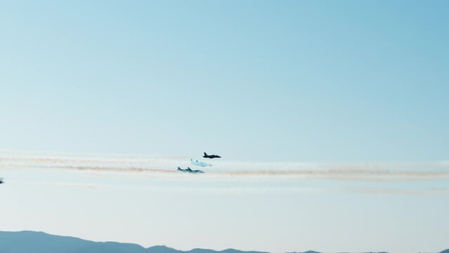 Tricolor Arrows Planes acrobatic show crossing in the air