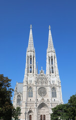 two very high bell towers of the VOTIVE CHURCH called Votivkirche in Vienna in Austria in europe