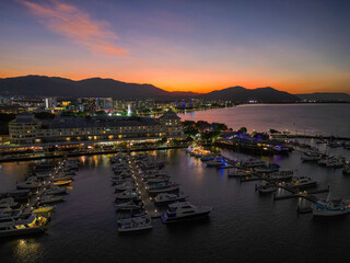 Fototapeta na wymiar Night time sunset drone shot at Cairns Marina and Esplanade