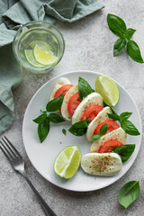 Caprese salad with tomatoes, mozzarella and basil.