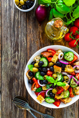 Panzanella salad on wooden table
