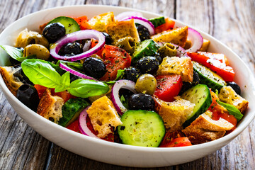 Panzanella salad on wooden table
