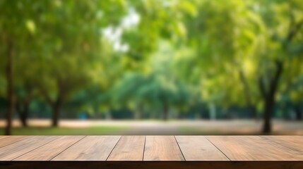 Empty wooden table for product display. Blurred green nature park background - obrazy, fototapety, plakaty