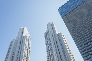 Fototapeta na wymiar Look up at urban buildings, residential skyscrapers, view up
